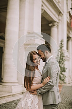 Young wedding couple on Capitoline hill in Rome