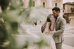 Young wedding couple on Capitoline hill in Rome