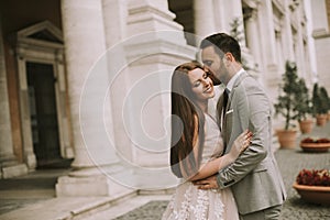 Young wedding couple on Capitoline hill in Rome