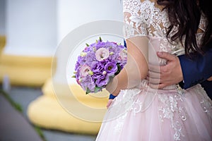 Young wedding couple enjoying romantic moments outside on a summer meadow