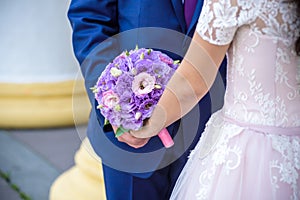 Young wedding couple enjoying romantic moments outside on a summer meadow