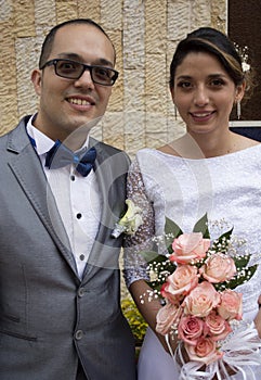 Young wedding couple kissing.