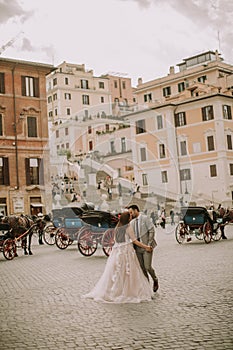 Young wedding couple near Spanish steps Scalinata di TrinitÃ  d