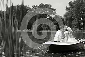 Young wedding couple sailing on the boat