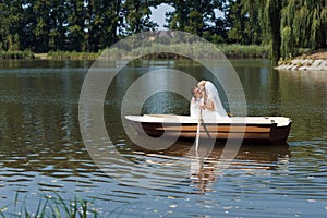 Young wedding couple sailing on the boat