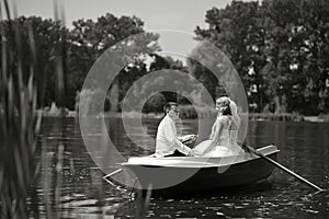 Young wedding couple sailing on the boat