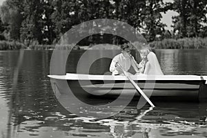 Young wedding couple sailing on the boat