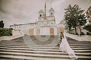 Young wedding couple on Spanish stairs in Rome