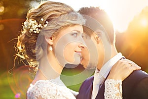 Young wedding couple on summer meadow
