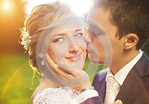 Young wedding couple on summer meadow