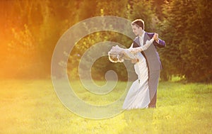 Young wedding couple on summer meadow