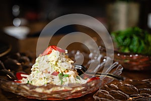 Young white cabbage and strawberry salad. Embedded slide on the plate. restaurant service.