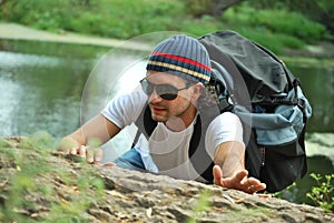 Young white man climbing