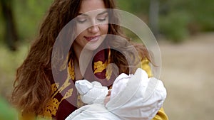 Young white woman with a newborn baby on her hands