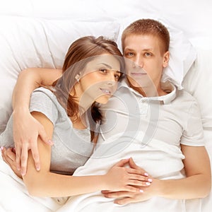 Young Wife and husband in bed