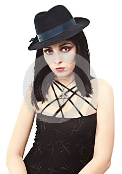 Young witch in halloween costume looking photo