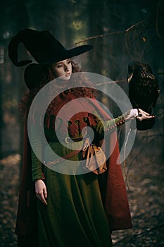 Young witch with raven