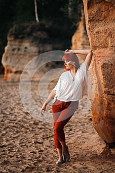 Young woamn posing near the sand-dune