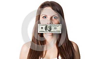 Young woman with 100 dollar bill on her lips