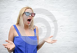 Young woman in 3d glasses surprising and screaming