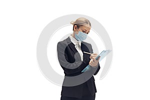 Young woman, accountant, booker in office suit isolated on white studio background