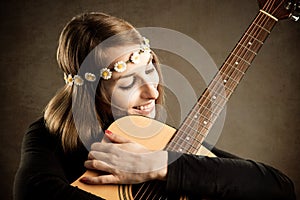 Young woman with acoustic guitar