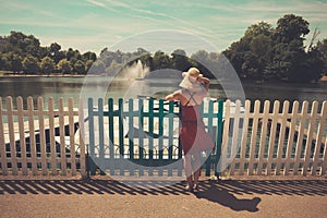 Young woman admiring boating lake