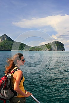 Young woman admiring scene from a boat, Ang Thong National Marin