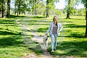 Young woman adopt young dog Labrador Retriever from animal rescue center and gave him love and friendship. Female animal lover spe