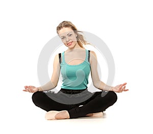 Young woman in advanced sitting yoga pose