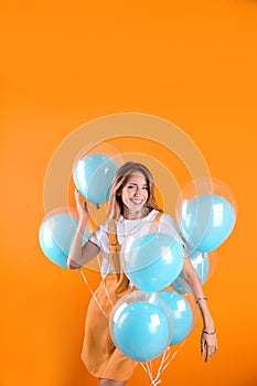 Young woman with air balloons