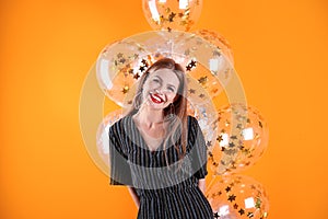 Young woman with air balloons