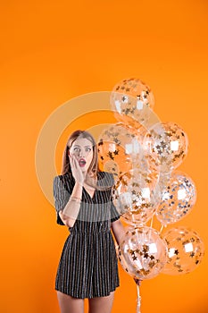 Young woman with air balloons