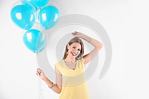 Young woman with air balloons