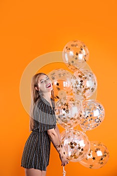 Young woman with air balloons