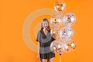 Young woman with air balloons