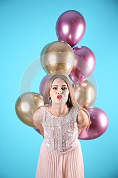 Young woman with air balloons