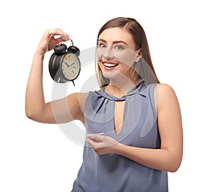 Young woman with alarm clock on white background. Time management concept