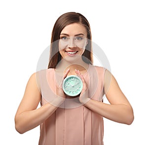 Young woman with alarm clock on white background. Time management concept