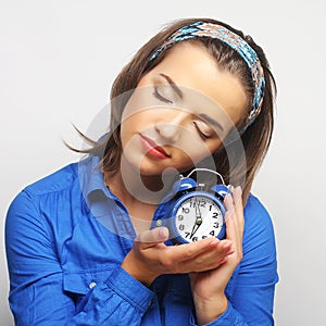 Young woman with alarmclock
