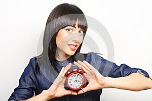 Young woman with alarmclock