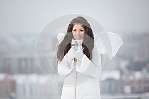 Young woman with angel wings