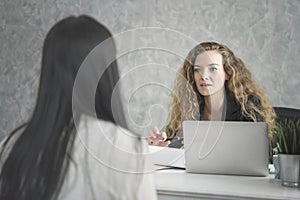 Young woman applicant and human resources his conversation