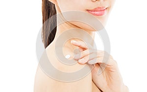 Young woman applying moisturize cream