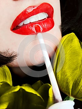 young woman applying red lip gloss / lipstick