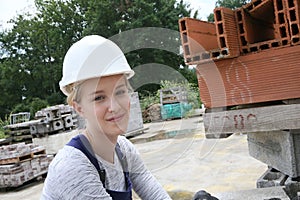 Young woman apprentice in construction