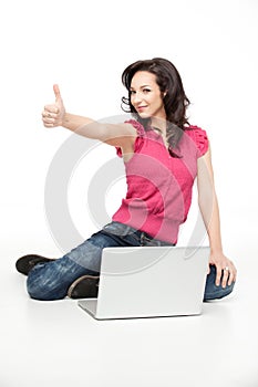 Young woman approving laptop photo