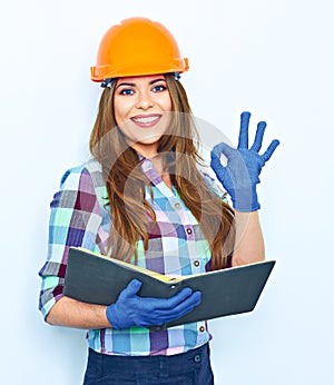 Young woman architect holding business paper show OK.