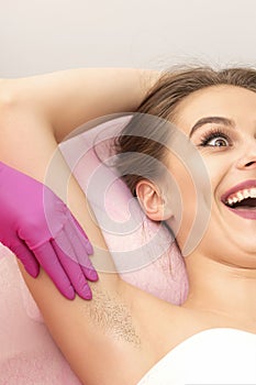 Young woman during armpit examination