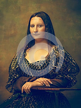 Young woman as Mona Lisa on dark background. Retro style, comparison of eras concept.